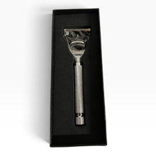 Load image into Gallery viewer, A silver metal safety razor with a knurled handle, presented inside a black rectangular gift box on a white background.
