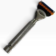Load image into Gallery viewer, A classic men's safety razor with a textured silver metal handle, a polished steel head, and a black and orange multi-blade head, shown on a plain white background.
